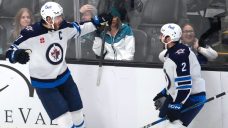 Lowry scores late goal to help Jets top Sharks