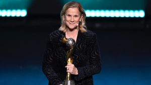 Former United States coach Jill Ellis with the trophy during the FIFA Women's World Cup 2023 draw in Auckland, New Zealand, Saturday. 22, 2022. (Alan Lee/Photosport via AP)