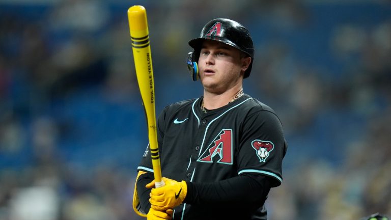 Arizona Diamondbacks' Joc Pederson holds his bat painted like a crayon during the first inning of a baseball game against the Tampa Bay Rays on Players' Weekend Friday, Aug. 16, 2024, in St. Petersburg, Fla. (Chris O'Meara/AP)