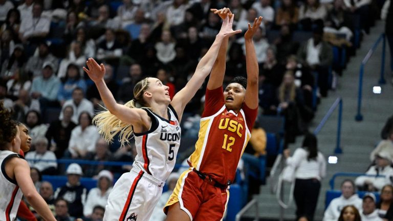 UConn guard Paige Bueckers (5) guards Southern California guard JuJu Watkins (12) in the second half, Saturday, Dec. 21, 2024, in Hartford, Conn. (Jessica Hill/AP)