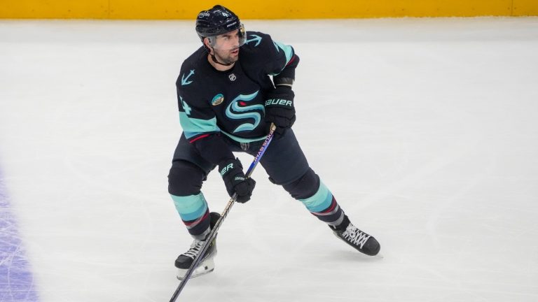 Seattle Kraken defenceman Justin Schultz moves the puck against the Buffalo Sabres during the third period of an NHL game Monday, March 18, 2024, in Seattle. (AP/Lindsey Wasson)