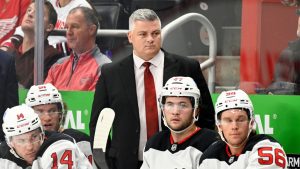 New Jersey Devils head coach Sheldon Keefe, centre top, watches the first period of an NHL hockey game against the Detroit Red Wings, Thursday, Oct. 24, 2024, in Detroit. (Jose Juarez/AP)