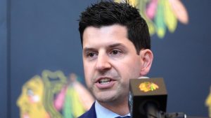 Chicago Blackhawks General manager Kyle Davidson speaks at a news conference during the team's NHL hockey camp Thursday, Sept. 19, 2024, in Chicago. (AP Photo/Charles Rex Arbogast)