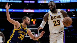 Golden State Warriors guard Stephen Curry (30) defends against Los Angeles Lakers forward LeBron James (23) during the second half of an NBA basketball game in Los Angeles, Saturday, March 16, 2024. (AP Photo/Ashley Landis)