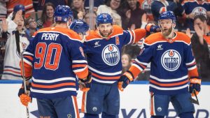 Edmonton Oilers' Corey Perry (90), Ryan Nugent-Hopkins (93), Leon Draisaitl (29) and Mattias Ekholm (14) celebrate a goal against the Florida Panthers during second period NHL action in Edmonton on Monday, December 16, 2024. (Jason Franson/CP)