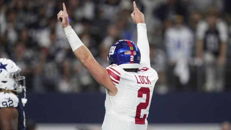 New York Giants quarterback Drew Lock (2) celebrates after running back Tyrone Tracy Jr. (29) scored a touchdown against the Dallas Cowboys during the first half of an NFL football game in Arlington, Texas, Thursday, Nov. 28, 2024. (Tony Gutierrez/AP)
