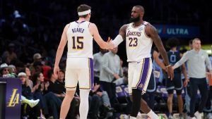 Los Angeles Lakers forward LeBron James (23) celebrates with guard Austin Reaves (15) during the first half of an NBA basketball game against the Memphis Grizzlies, Sunday, Dec. 15, 2024, in Los Angeles. (Jessie Alcheh/AP)