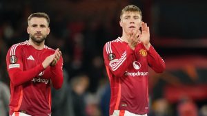 Manchester United's Luke Shaw, left, and Manchester United's Rasmus Hojlund greet fans at the end of the Europa League opening phase soccer match between Manchester United and Bodo Glimt, at the Old Trafford stadium in Manchester, England, Thursday, Nov. 28, 2024. (AP/Dave Thompson)