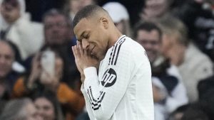 Real Madrid's Kylian Mbappe celebrates after scoring the opening goal during the Spanish La Liga soccer match between Real Madrid and Sevilla at the Santiago Bernabeu Stadium in Madrid, Spain, Sunday, Dec. 22, 2024. (Bernat Armangue/AP)