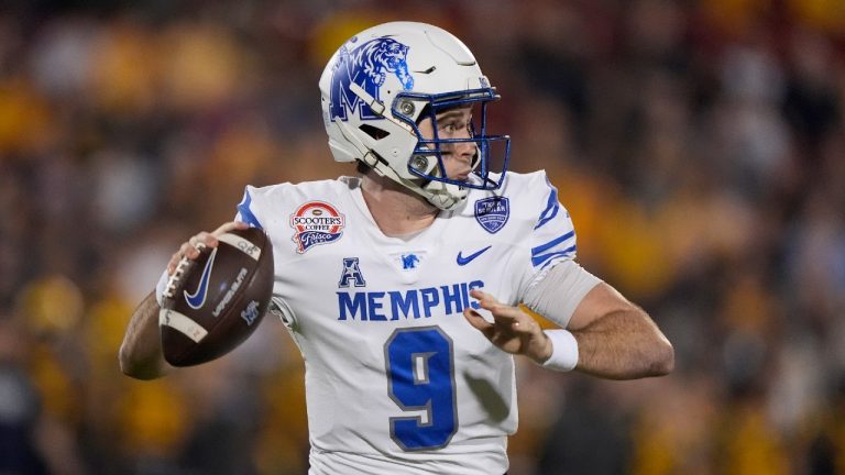 Memphis quarterback Seth Henigan (9) passes during the first half against West Virginia during the Frisco Bowl NCAA college football game Tuesday, Dec. 17, 2024, in Frisco, Texas. (LM Otero/AP)