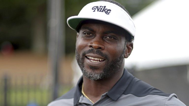 Former Atlanta Falcons quarterback Michael Vick speaks to members of the media during NFL football training camp at the team's practice facility. (Jason Getz/Atlanta Journal-Constitution via AP)