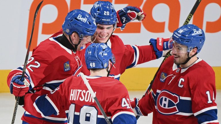 Montreal Canadiens' Patrik Laine (92) celebrates with teammates Juraj Slafkovsky (20), Lane Hutson (48) and Nick Suzuki (14) after scoring his third goal against the Buffalo Sabres during second period NHL hockey action in Montreal, Tuesday, December 17, 2024. THE CANADIAN PRESS/Graham