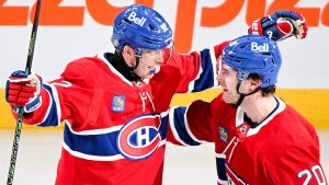 Montreal Canadiens' Patrik Laine (92) celebrates with teammate Juraj Slafkovsky (20) after scoring his third goal against the Buffalo Sabres during second period NHL hockey action in Montreal, Tuesday, December 17, 2024. (Graham/CP)