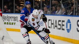 New York Rangers' Chris Kreider (20) defends Chicago Blackhawks' Connor Murphy (5) during the first period of an NHL hockey game, Monday, Dec. 9, 2024, in New York. (Frank Franklin II/AP)