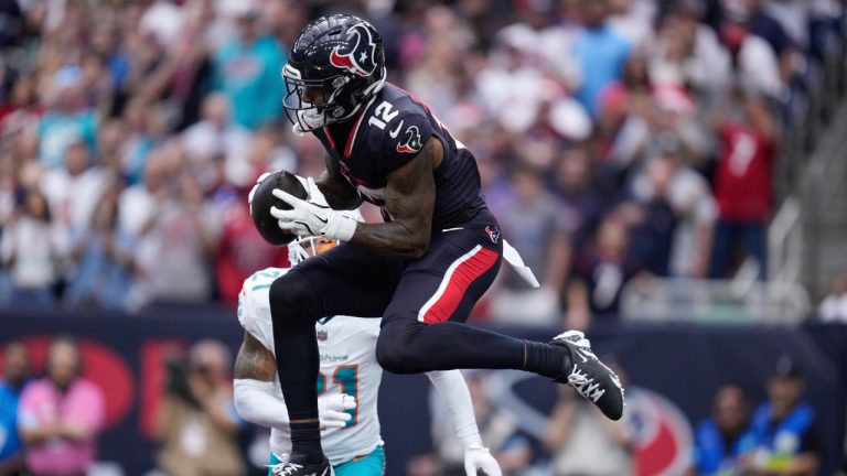 Houston Texans wide receiver Nico Collins (12) catches a touchdown pass during the first half of an NFL football game against the Miami Dolphins, Sunday, Dec. 15, 2024, in Houston. (Eric Christian Smith/AP)