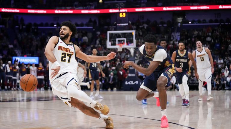 New Orleans Pelicans forward Herbert Jones fouls Denver Nuggets guard Jamal Murray (27) during overtime of an NBA basketball game in New Orleans, Sunday, Dec. 22, 2024. (Gerald Herbert/AP)