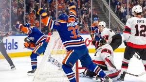 Edmonton Oilers' Viktor Arvidsson (33) celebrates after a goal from teammate Zach Hyman (18) against the Ottawa Senators during second period NHL action in Edmonton, Sunday, Dec. 22, 2024. (Timothy Matwey/CP)