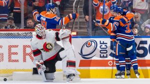 Edmonton Oilers' Viktor Arvidsson (33) celebrates his goal against Ottawa Senators' goaltender Linus Ullmark (35) with his teammates during first period NHL action in Edmonton, Sunday, Dec. 22, 2024. (Timothy Matwey/CP)