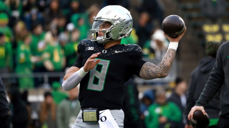 Oregon quarterback Dillon Gabriel warms up before an NCAA college football game against Washington, Saturday, Nov. 30, 2024, in Eugene, Ore. (Lydia Ely/AP)