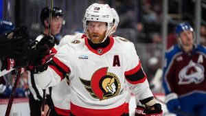 Ottawa Senators right wing Claude Giroux is congratulated as he passes the team box after scoring a goal against the Colorado Avalanche in the third period of an NHL hockey game Sunday, Oct. 27, 2024, in Denver. (David Zalubowski/AP)