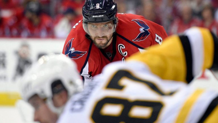 Washington Capitals left wing Alex Ovechkin (8) looks as Pittsburgh Penguins centre Sidney Crosby (87) gets ready for a face-off. (Nick Wass/AP)