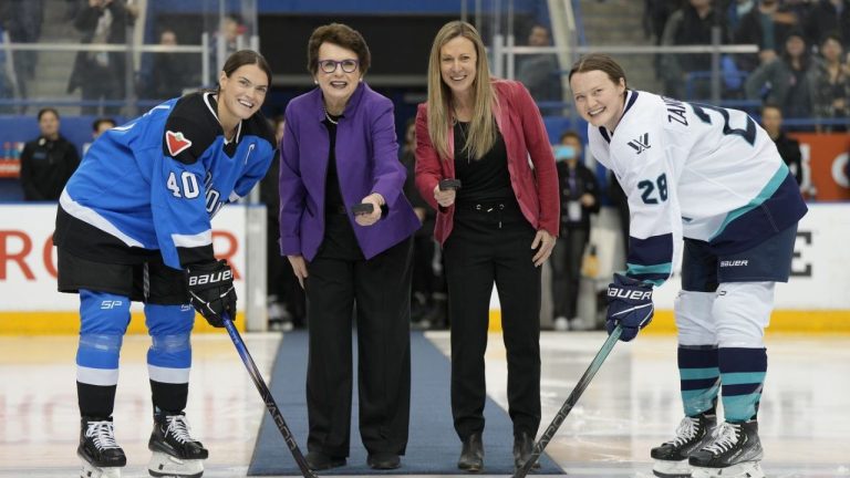 PWHL board member Billie Jean King and PWHL executive Jayna Hefford prepare to drop pucks between Toronto captain Blayre Turnbull and New York captain Micah Zandee-Hart for the ceremonial faceoff before the inaugural PWHL game in Toronto on Monday, Jan.1, 2024. (Frank Gunn/CP)