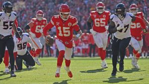 Kansas City Chiefs quarterback Patrick Mahomes rushes for a touchdown during an NFL game against the Houston Texans Saturday, Dec. 21, 2024, in Kansas City, Mo. (AP/Peter Aiken)