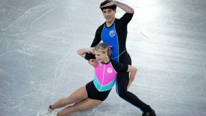 Piper Gilles and Paul Poirier, of Canada, compete in the ice dance's rhythm dance segment at the ISU Grand Prix Finals of Figure Skating, Friday, Dec. 6, 2024, in Grenoble, France. (AP Photo/Laurent Cipriani)