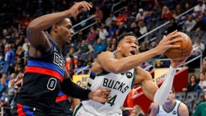 Milwaukee Bucks forward Giannis Antetokounmpo (34) goes to the basket past Detroit Pistons center Jalen Duren (0) during the first half of an Emirates NBA Cup basketball game Tuesday, Dec. 3, 2024, in Detroit. (AP Photo/Duane Burleson)