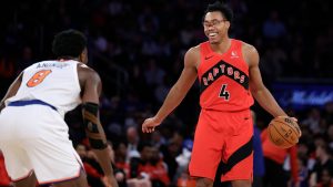 Toronto Raptors forward Scottie Barnes (4) reacts in front of New York Knicks forward OG Anunoby (8) during the first half of an NBA basketball game Monday, Dec. 23, 2024, in New York. The Knicks won 139-125. (AP Photo/Adam Hunger)