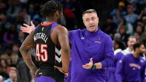 Toronto Raptors head coach Darko Rajakovic, right, talks with guard Davion Mitchell (45) in the first half of an NBA basketball game against the Memphis Grizzlies, Thursday, Dec. 26, 2024, in Memphis, Tenn. (AP Photo/Brandon Dill)