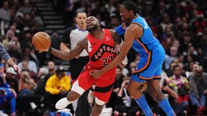 Toronto Raptors' Jamal Shead (23) tries to get past Oklahoma City Thunder's Jalen Williams (8) during first half NBA basketball action in Toronto on Thursday, December 5, 2024. (Nathan Denette/CP)