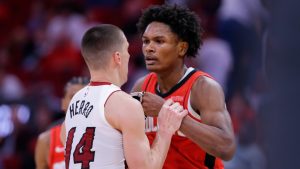 Houston Rockets forward Amen Thompson, right, and Miami Heat guard Tyler Herro (14) tug on each other before Thompson throws Herro to the court sparking a bench clearing brawl resulting in multiple ejections for both teams during the second half of an NBA basketball game Sunday, Dec. 29, 2024, in Houston. (AP Photo/Michael Wyke)