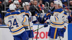 Buffalo Sabres' Jiri Kulich, centre, celebrates with teammates after scoring a goal during the first period of an NHL hockey game against the New York Islanders Monday, Dec. 23, 2024, in Elmont, N.Y. (Frank Franklin II/AP)