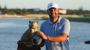 Scottie Scheffler, of the United States, poses with the championship trophy after the final round of the Hero World Challenge PGA Tour at the Albany Golf Club in New Providence, Bahamas, Sunday, Dec. 8, 2024. (AP/Fernando Llano)