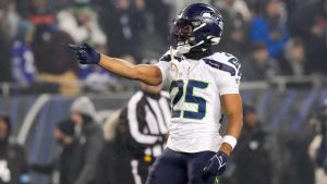 Seattle Seahawks running back Kenny McIntosh gestures after a play against the Chicago Bears during the first half of an NFL football game, Thursday, Dec. 26, 2024, in Chicago. (Nam Y. Huh/AP)