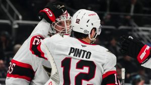 Ottawa Senators goaltender Linus Ullmark, left, is greeted by centre Shane Pinto (12) as they celebrate a 3-0 win over the Seattle Kraken in an NHL hockey game Tuesday, Dec. 17, 2024, in Seattle. (Lindsey Wasson/AP)