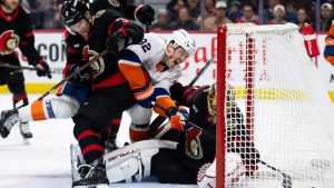 New York Islanders centre Kyle MacLean (32) scores on Ottawa Senators goaltender Anton Forsberg (31) during first period NHL hockey action in Ottawa, on Sunday, Dec. 8, 2024. (Spencer Colby/AP)