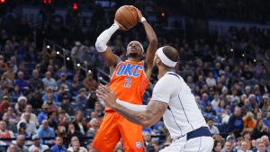 Oklahoma City Thunder guard Shai Gilgeous-Alexander (2) shoots against Dallas Mavericks center Daniel Gafford, right, during the first half of an Emirates NBA Cup basketball game, Tuesday, Dec. 10, 2024, in Oklahoma City. (Nate Billings/AP)