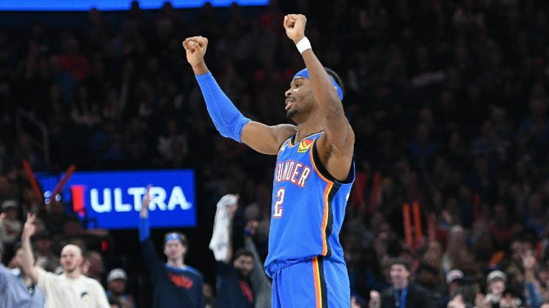 Oklahoma City Thunder guard Shai Gilgeous-Alexander celebrates after a basket during the first half of an NBA basketball game. (Kyle Phillips/AP)