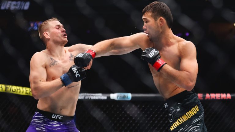 Shavkat Rakhmonov, right, punches Ian Machado Garry in a UFC 310 mixed martial arts welterweight bout at T-Mobile Arena, Saturday, Dec. 7, 2024, in Las Vegas. (Wade Vandervort/Las Vegas Sun via AP)