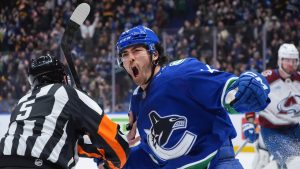 Vancouver Canucks' Kiefer Sherwood celebrates his second goal against the Colorado Avalanche during the second period of an NHL hockey game in Vancouver, on Monday, December 16, 2024. (Darryl Dyck/CP)