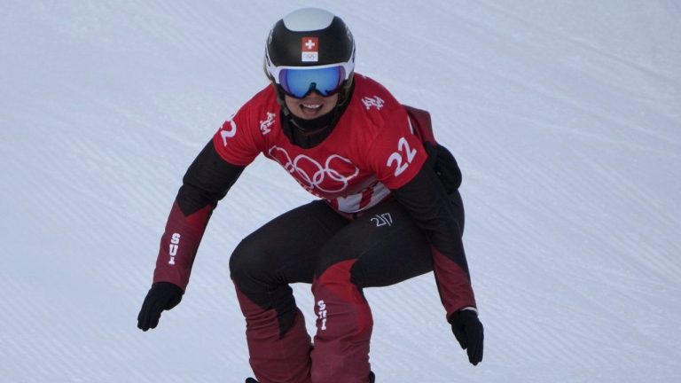 Switzerland's Sophie Hediger competes during the women's snowboard cross qualification round at the 2022 Winter Olympics, Feb. 9, 2022, in Zhangjiakou, China. (Aaron Favila/AP)