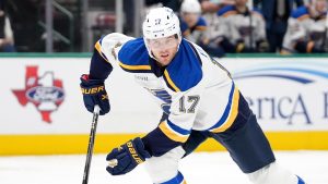 St. Louis Blues defenseman Cam Fowler skates to the puck in the first period of an NHL hockey game against the Dallas Stars in Dallas, Saturday, Dec. 14, 2024. (Tony Gutierrez/AP)