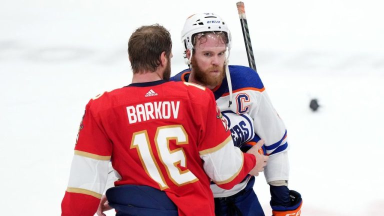 Edmonton Oilers forward Connor McDavid (97) is consoled by Florida Panthers forward Aleksander Barkov (16) after Florida defeated Edmonton in game 7 of the NHL Stanley Cup finals in Sunrise, Fla., on Monday, June 24, 2024. (Nathan Denette/CP)