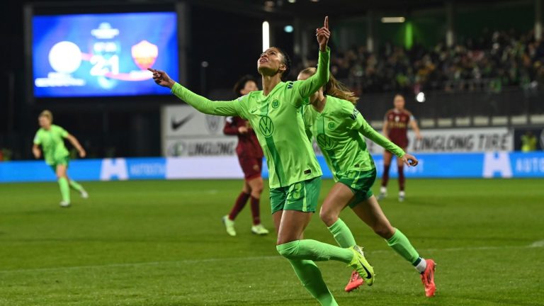 Wolfsburg's Sveindis Jonsdottir celebrates scoring during the women's Champions League soccer match between VfL Wolfsburg and AS Roma at AOK Stadion in Wolfsburg, Germany, Wednesday Dec. 11, 2024. (Swen Pförtner/dpa via AP)