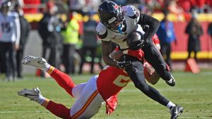 Houston Texans wide receiver Tank Dell runs up field during an NFL game against Kansas City Chiefs safety Justin Reid Saturday, Dec. 21, 2024, in Kansas City, Mo. (AP/Peter Aiken)