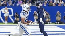 Taylor rebounds with 218 yards, three TD runs as Colts hold off Titans