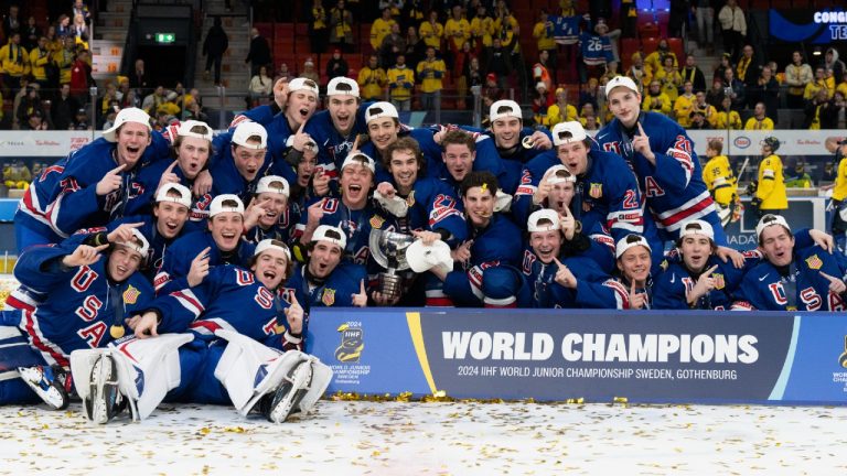 Team USA poses for photographers after winning the gold medal over Sweden at the IIHF World Junior Hockey Championship in Gothenburg, Sweden, Friday, Jan. 5, 2024. (Christinne Muschi/CP)