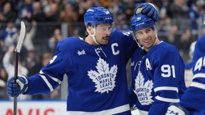 Toronto Maple Leafs centre John Tavares (91) celebrates his goal against the Buffalo Sabres with teammates Auston Matthews (34) and Morgan Rielly (44) during second period NHL hockey action in Toronto, Sunday, Dec. 15, 2024. (Frank Gunn/CP)